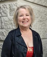 Poet Olive L. Sullivan smiling at camera