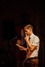 Joe Hall reading a poem. Photo courtesy of Patrick Cray.
