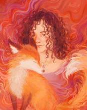A woman with wild, curly hair smiles next to a fox.